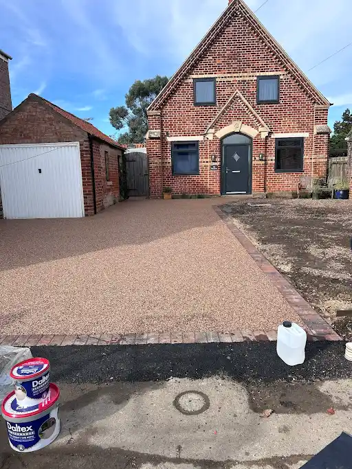 Resin path and decorative edging for a domestic property